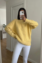 Sienna Yellow fuzzy crew-neck sweater with dropped shoulders and ribbed hem styled with white leggings.
