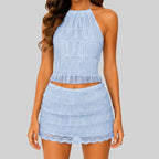Front view of sky blue lace crop top and mini skirt set with smocked texture and scalloped hem by BELLA HUDSON