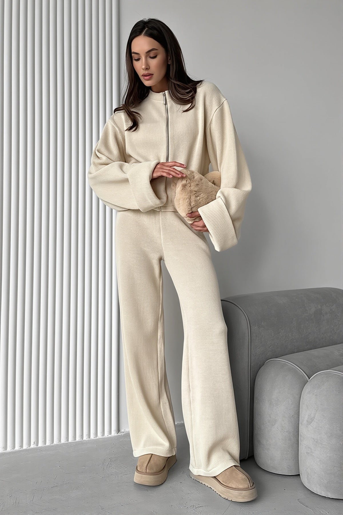 Sloane Apricot ribbed knit zip jacket and wide-leg pants set shown full-body in a soft cream tone.