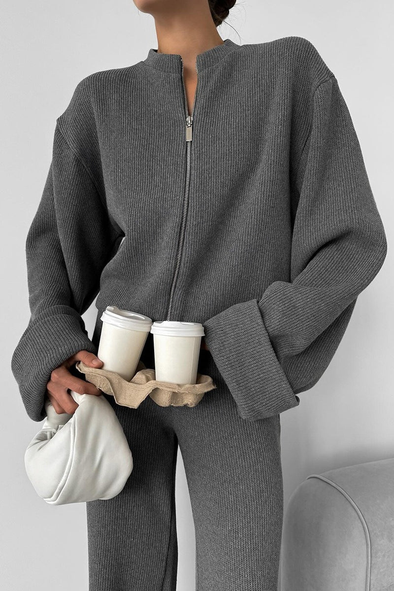 Sloane Gray close-up of the ribbed zip-front jacket with round neckline and folded cuffs.