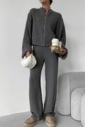 Sloane Gray ribbed knit zip jacket and wide-leg pants set styled full-body with a white bag and coffee cups.