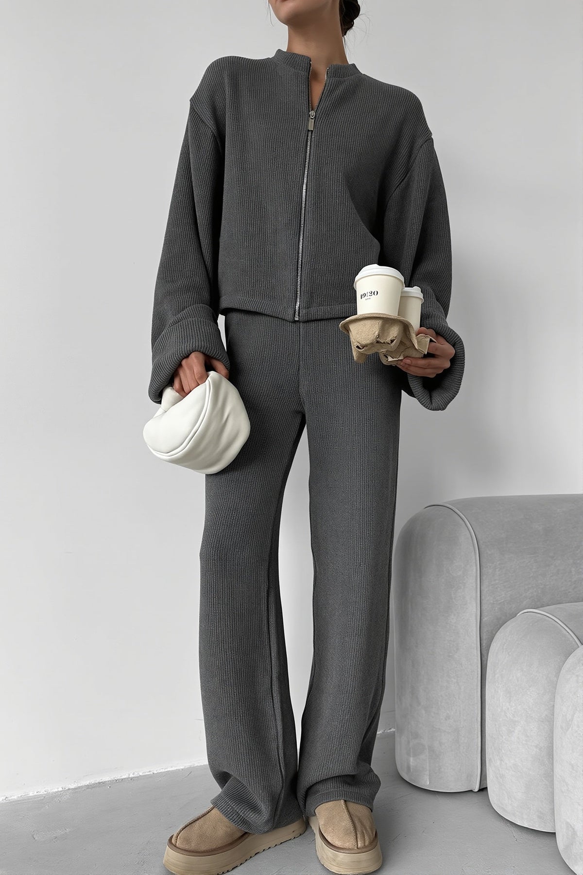 Sloane Gray ribbed knit zip jacket and wide-leg pants set styled full-body with a white bag and coffee cups.