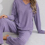 Sloane Purple ribbed two-piece lounge set featuring a relaxed V-neck top, long sleeves, and coordinated wide-leg pants