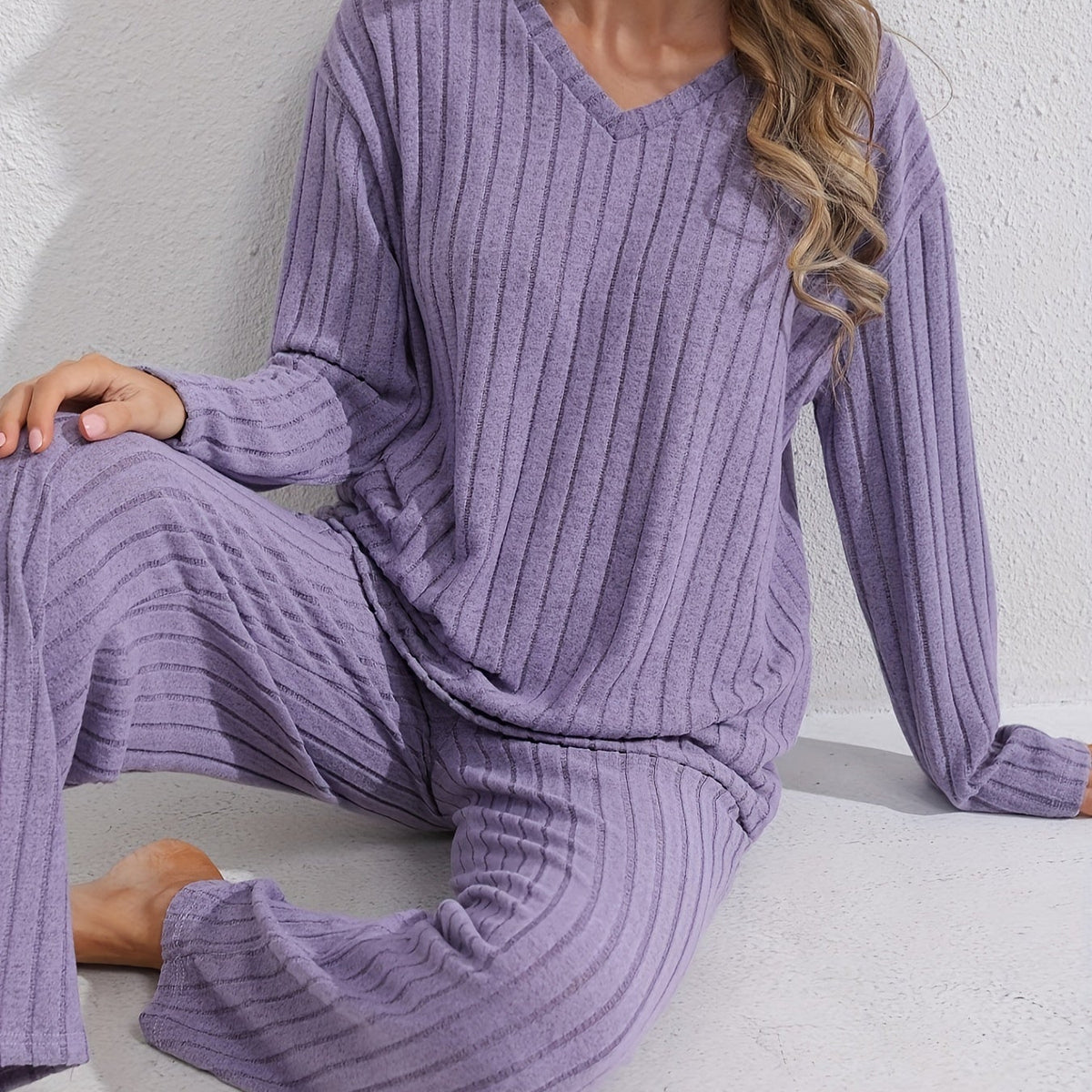 Sloane Purple ribbed two-piece lounge set featuring a relaxed V-neck top, long sleeves, and coordinated wide-leg pants
