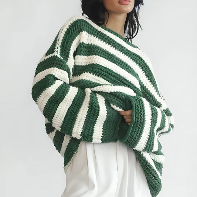 Front view of the Solange Sweater Chunky-Knit Striped in green, featuring wide green and white horizontal stripes, a round neckline, long sleeves, chunky knit texture, and an oversized relaxed silhouette. Designed by Bella Hudson.