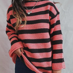 Front view of the Solange Sweater Chunky-Knit Striped in pink, featuring pink and dark horizontal stripes, a round neckline, long sleeves, chunky knit texture, and a relaxed oversized silhouette. Designed by Bella Hudson.