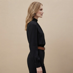 Side view of the Solenne Blouse Stand-Collar Long-Sleeve in Black, showcasing its relaxed fit and long sleeves.