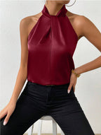 Front view of the Solenne Top Satin Halter Tie-Neck in dark red, featuring a halter tie neckline, sleeveless silhouette, and smooth satin finish. Designed by Bella Hudson.