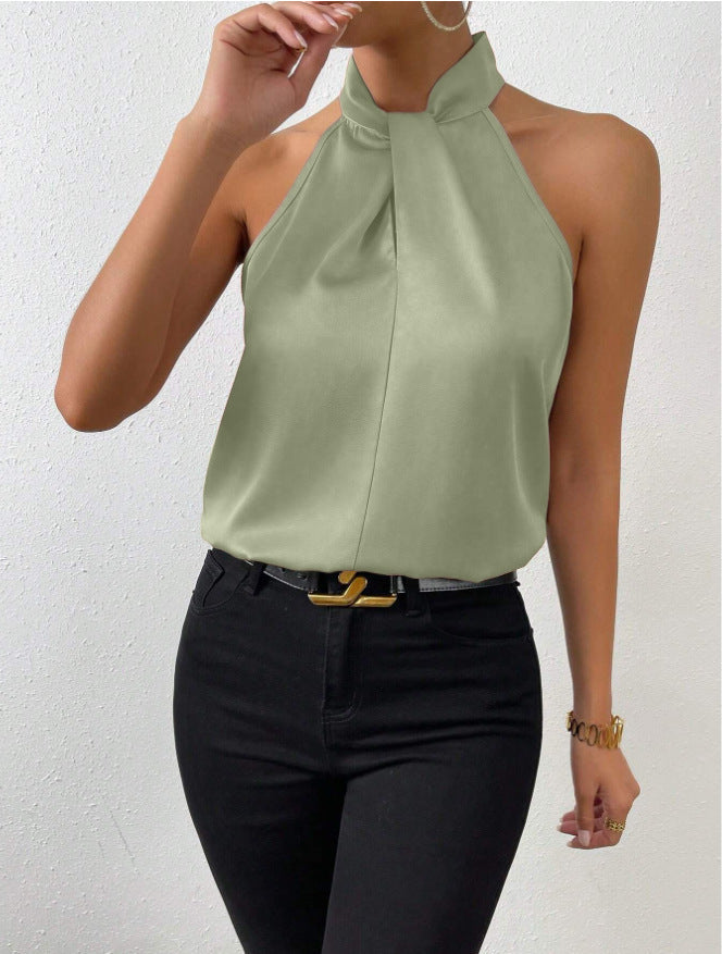 Front view of the Solenne Top Satin Halter Tie-Neck in light green, featuring a halter tie neckline, sleeveless silhouette, smooth satin fabric, and an elegant relaxed fit. Designed by Bella Hudson.