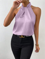 Front view of the Solenne Top Satin Halter Tie-Neck in lilac, featuring a halter tie neckline, sleeveless silhouette, lustrous satin fabric, and an elegant relaxed fit. Designed by Bella Hudson.