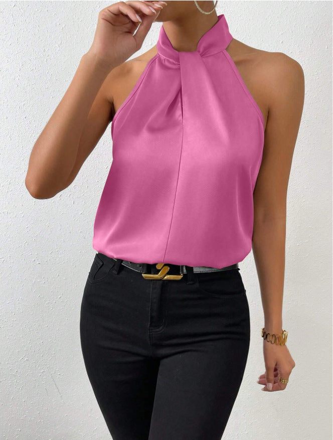Front view of the Solenne Top Satin Halter Tie-Neck in pink, featuring a halter tie neckline, sleeveless design, lustrous satin fabric, and a relaxed elegant silhouette. Designed by Bella Hudson.
