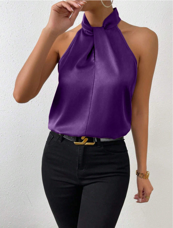 Front view of the Solenne Top Satin Halter Tie-Neck in purple, featuring a halter tie neckline, sleeveless design, silky satin fabric, and a graceful draped silhouette. Designed by Bella Hudson.