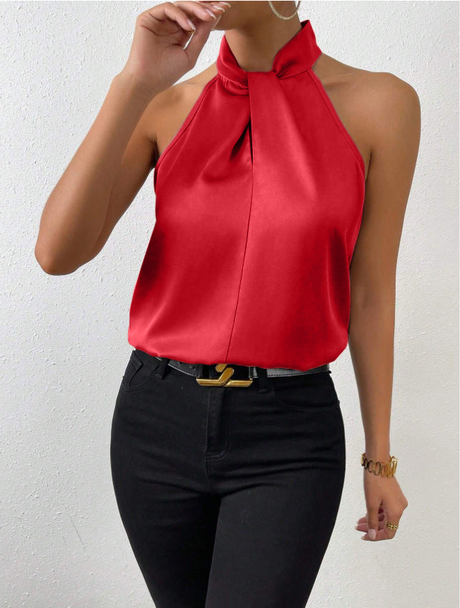 Front view of the Solenne Top Satin Halter Tie-Neck in red, featuring a halter tie neckline, sleeveless design, and silky satin finish. Designed by Bella Hudson.