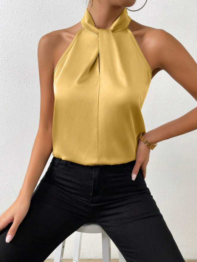Front view of the Solenne Top Satin Halter Tie-Neck in yellow, featuring a halter tie neckline, sleeveless design, and lustrous satin fabric. Designed by Bella Hudson.