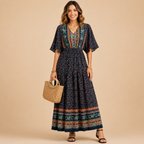 Solveig deep V-neck maxi dress in black, front view, designed by Bella Hudson