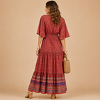 Solveig deep V-neck maxi dress in red, back view, designed by Bella Hudson