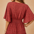 Solveig deep V-neck maxi dress in red, close-up detail view, designed by Bella Hudson