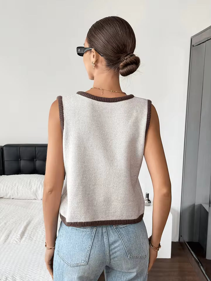 Sophie Beige knit sweater vest shown from the back, featuring a sleeveless design, round neckline, and ribbed hem
