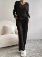 Sophie Black matching knit loungewear set with relaxed long-sleeve top, V-neckline, and wide-leg pants