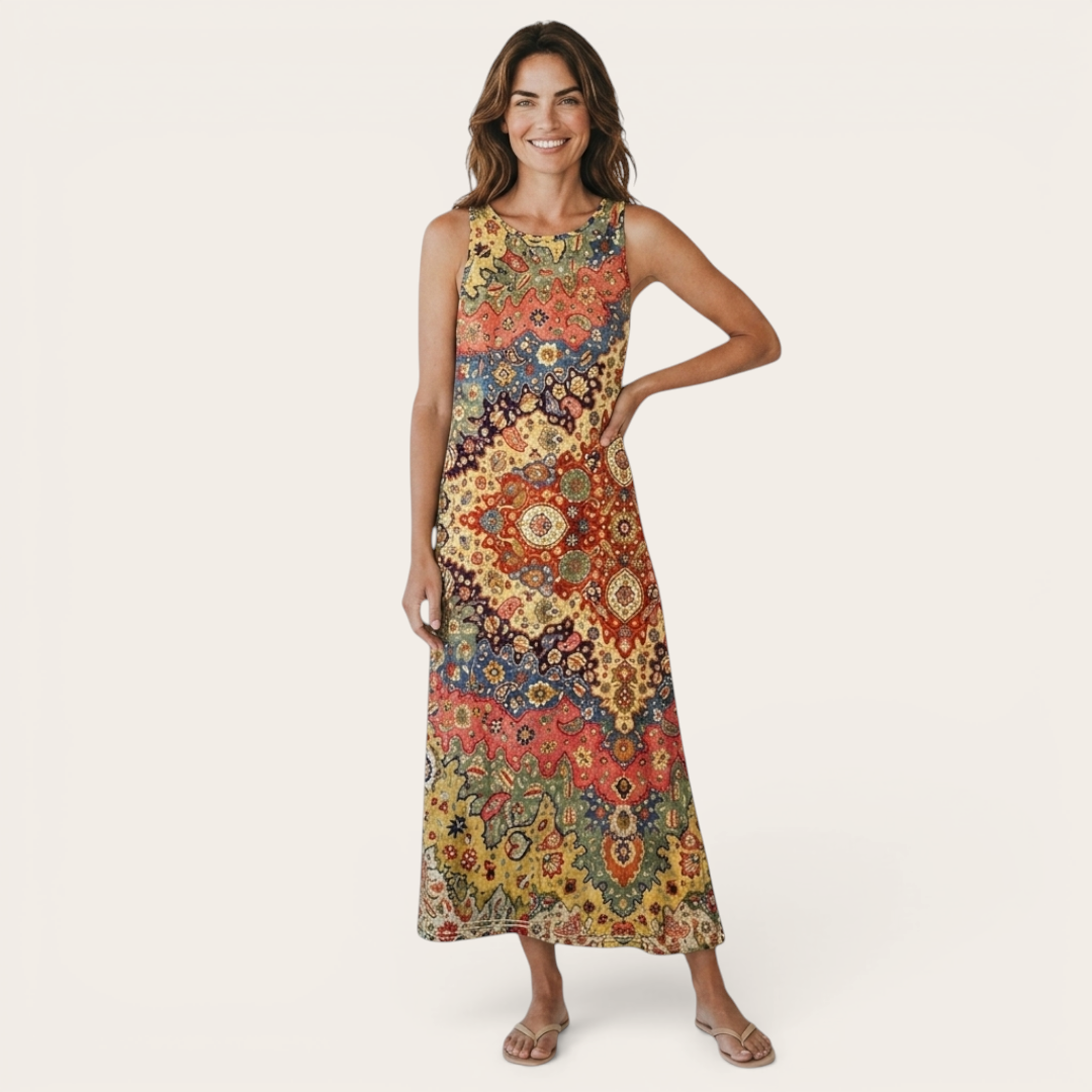 Front view of the Sunniva Midi Dress Sleeveless Bohemian-Print Rustic in yellow, featuring a sleeveless round neckline, vibrant bohemian-inspired print, relaxed A-line silhouette, and flowing midi-length design. Designed by Bella Hudson.