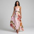 Front view of the Talia Maxi Dress Floral-Print Satin with Halter Neck in lavender, featuring a halter neckline, satin finish, flowing maxi silhouette, and oversized floral print. Designed by Bella Hudson.