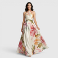 Front view of the Talia Maxi Dress Floral-Print Satin with Halter Neck in pink, featuring a halter neckline, satin finish, flowing A-line skirt, and oversized floral print. Designed by Bella Hudson.