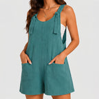 Front view of teal sleeveless short jumpsuit with side pockets by BELLA HUDSON