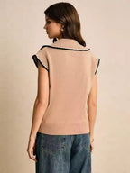 Tessa Brown sleeveless knit sweater vest shown from the back, featuring a polo collar, contrast edging, and ribbed hem