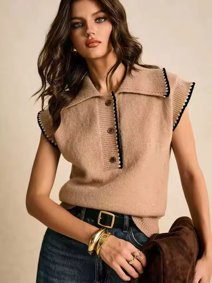 Tessa Brown collared knit sweater vest with contrasting trim and partial button placket, styled with jeans