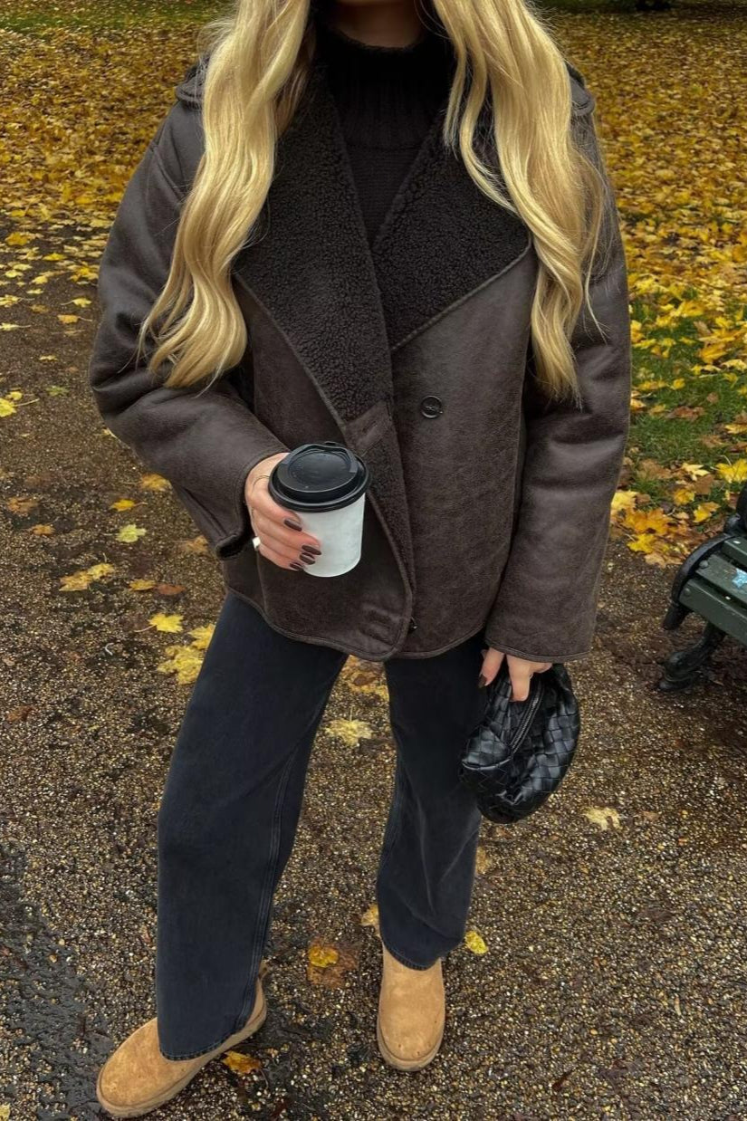 Tessa Brown faux suede jacket styled with dark jeans and tan boots, showing the oversized length and button front.