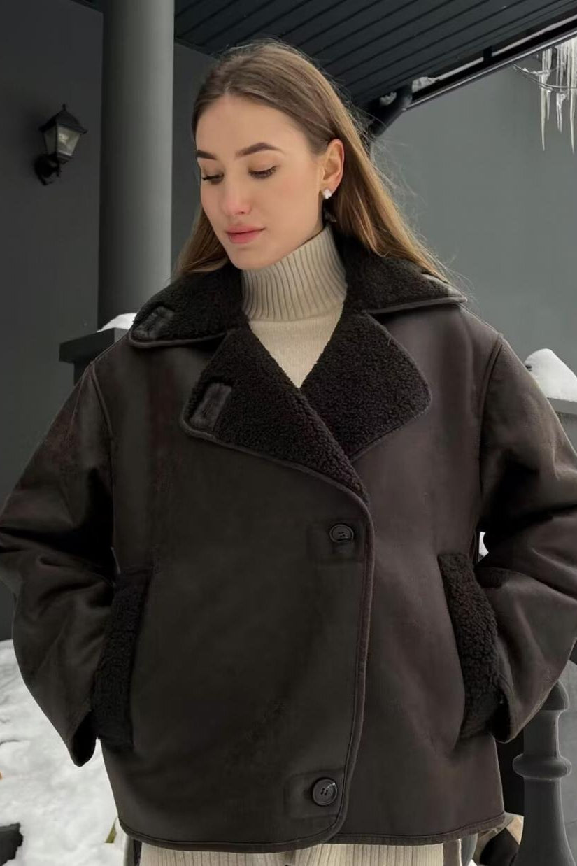 Tessa Brown faux suede jacket shown from a side-front angle with a wide textured collar, button front, and relaxed oversized silhouette