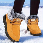 Tessa Brown snow boots with faux fur lining, adjustable lace-up front, and thick textured soles