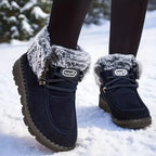 Tessa Dark Blue snow boots with plush faux fur collar, lace-up closure, and rounded toe, shown on feet