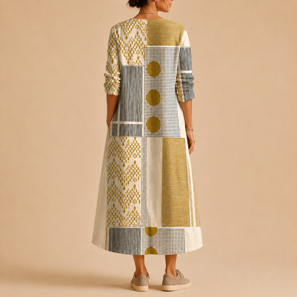 Tessa Lightweight Patchwork Linen Midi Dress, back view featuring the flowing midi silhouette and contemporary patchwork design. Designed by Bella Hudson.