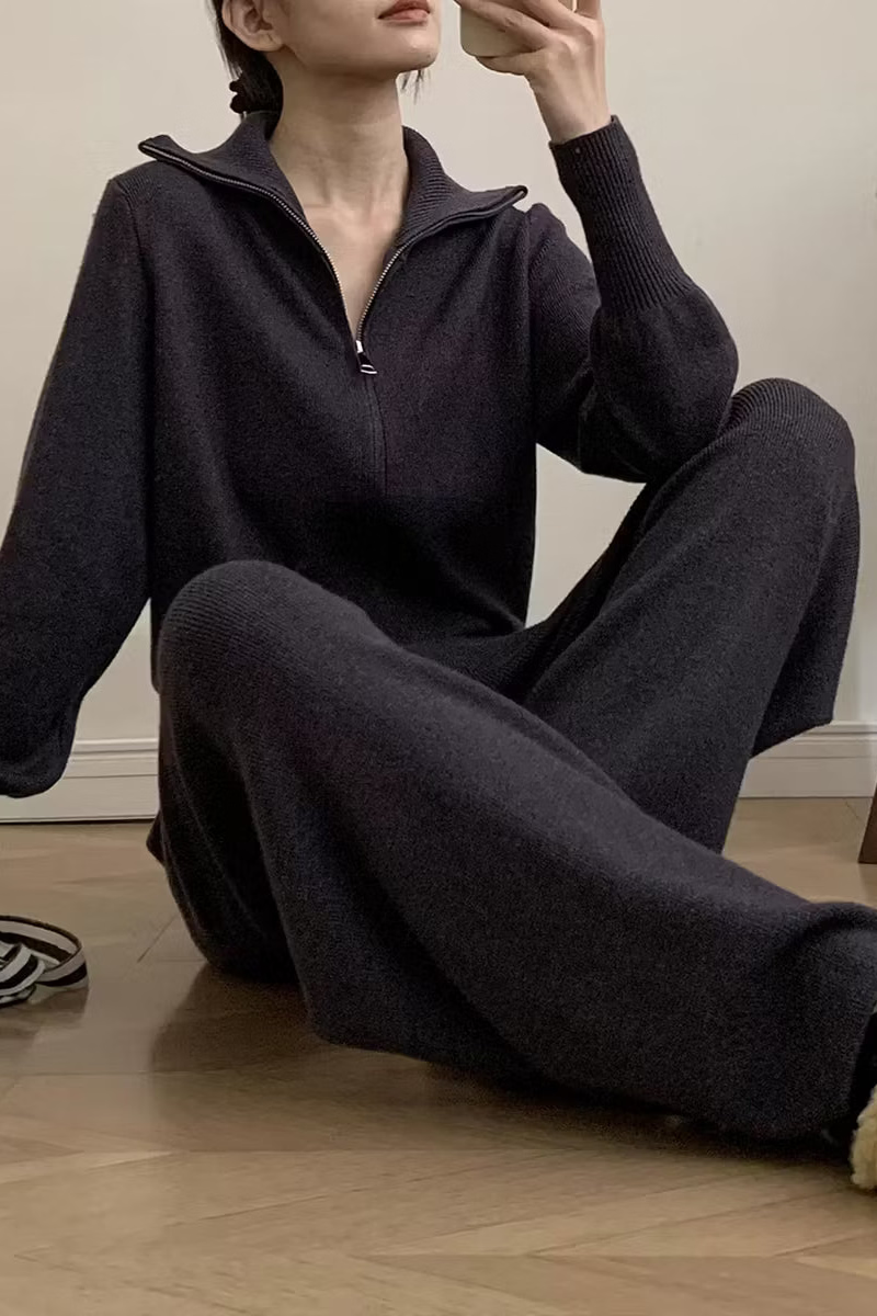 Tessa ribbed knit lounge set shown seated with a full-zip cardigan, relaxed silhouette, and matching wide-leg pants