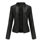 Front view of the Théodine Jacket Faux-Leather Stand-Collar in black, featuring a structured stand collar, zip-front closure, long sleeves, and a fitted faux-leather silhouette. Designed by Bella Hudson.