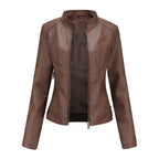Front view of the Théodine Jacket Faux-Leather Stand-Collar in brown, featuring a stand collar, zip-front closure, long sleeves, fitted waist, and smooth faux-leather finish. Designed by Bella Hudson.