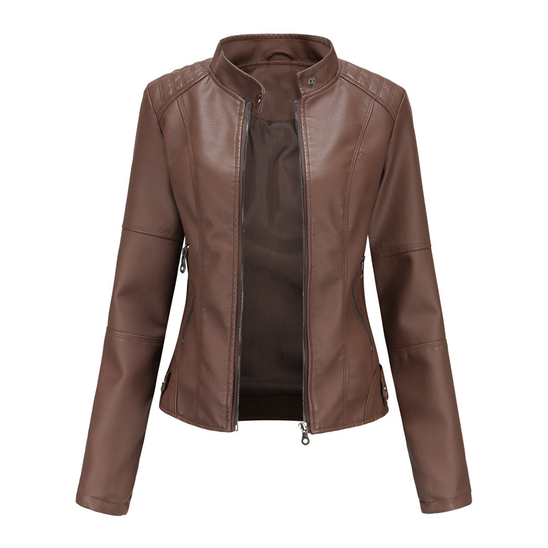 Front view of the Théodine Jacket Faux-Leather Stand-Collar in brown, featuring a stand collar, zip-front closure, long sleeves, fitted waist, and smooth faux-leather finish. Designed by Bella Hudson.