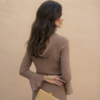 Back view of the Theodora Blouse Cowl-Neck Long-Sleeve in Brown, highlighting its relaxed silhouette and long sleeves. Designed by Bella Hudson.
