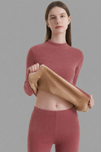 Women's fitted thermal base layer set featuring long sleeves, a high neckline, and matching high-waisted leggings
