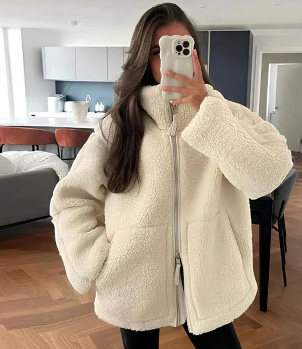Victoria White teddy fleece zip-up jacket with an oversized high collar, front pockets, relaxed silhouette, and long sleeves