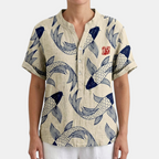 Front view of the Vintage Fish-Print Linen Shirt in beige, featuring a band collar, button-front closure, short sleeves, and an all-over fish print on a breathable linen-blend fabric. Designed by Bella Hudson.