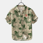 Front view of the Vintage Fish-Print Linen Shirt in dark green, featuring a band collar, button-front closure, short sleeves, and a vintage-inspired fish print. Designed by Bella Hudson.