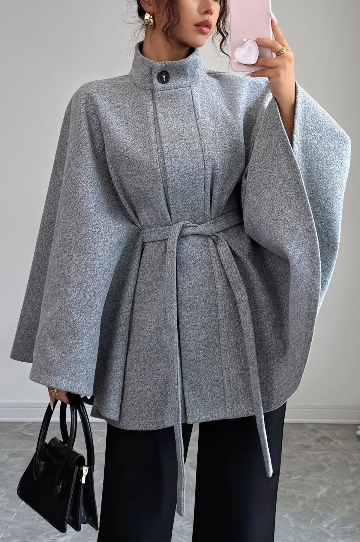 Vivian Gray belted cape coat featuring a structured stand collar, wide sleeves, adjustable waist belt, and relaxed cape-style shape