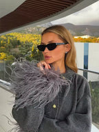 Vivienne Gray knit cardigan with textured fabric, statement feather-look cuffs, and button-front design