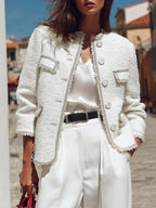 Vivienne White jacket in a close-up showing the fringed edges, button front, flap pockets, and textured weave.
