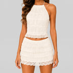 Front view of white B lace crop top and mini skirt set with smocked texture and scalloped hem by BELLA HUDSON