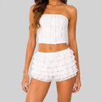 Front view of white B layered ruffle mini shorts with elastic waist by BELLA HUDSON