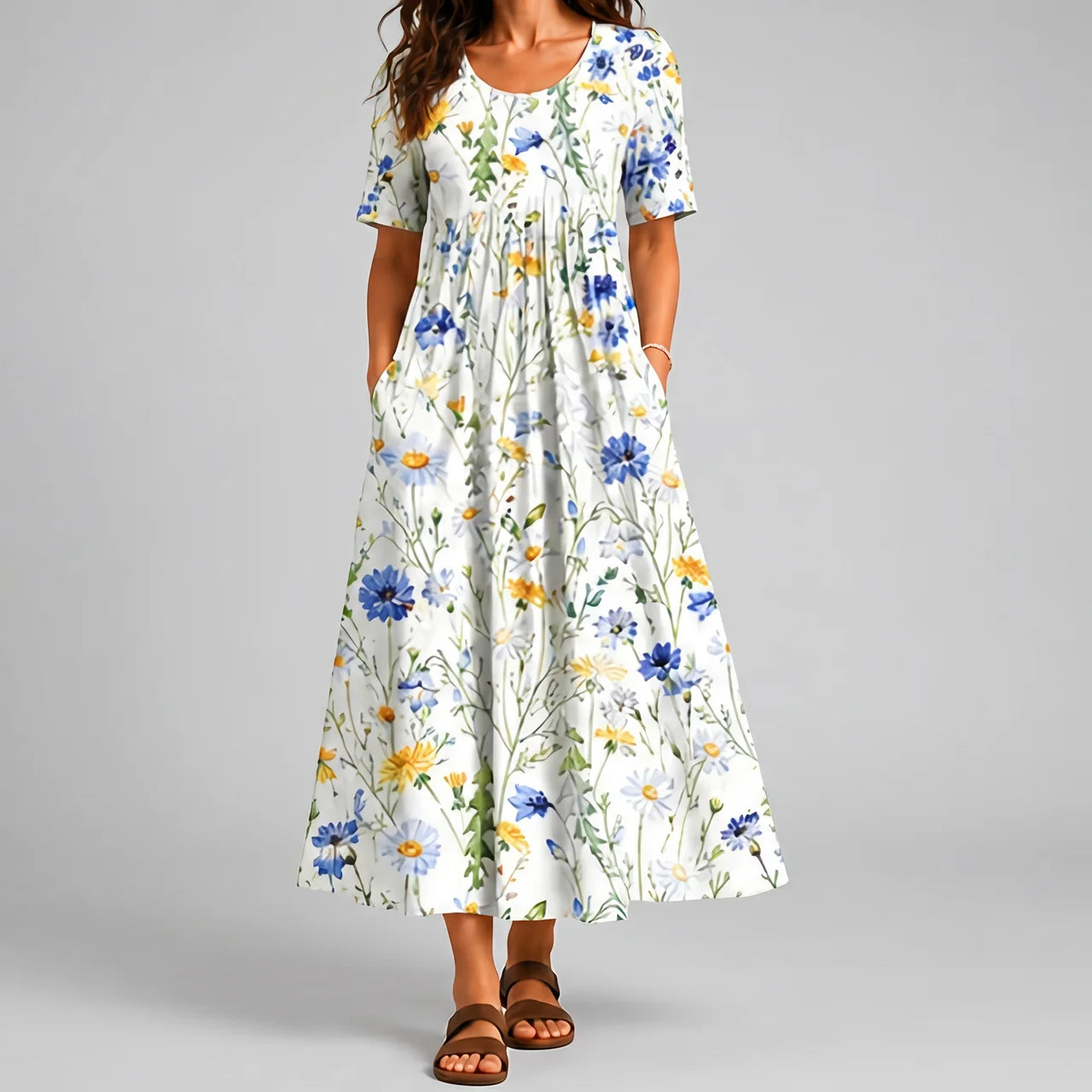 White floral maxi dress front view with blue and yellow flower print and pockets BELLA HUDSON