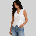 Side view of white eyelet button vest blouse with sleeveless tailored fit by BELLA HUDSON